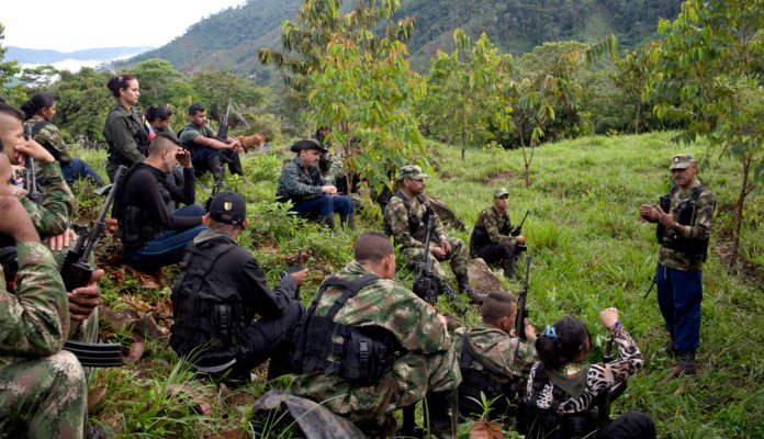 18-01-16-Leonidas-commander-36th-front-FARC-EX-farc-mafia-dissidents-Credit-Rodrigo-Abd-AP_123461069100-696x400